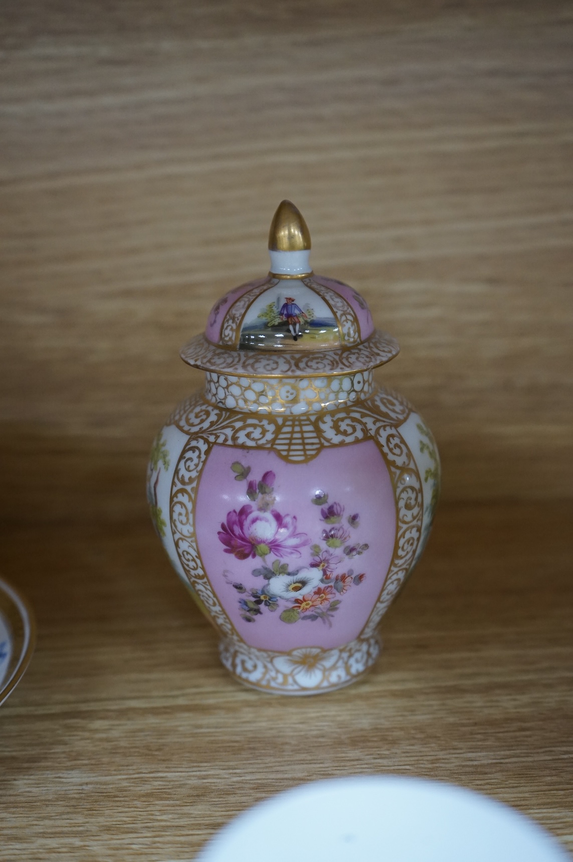 A Worcester butterfly handled cup and saucer and four other items, together with Royal Crown Derby, Dresden and Coalport items. (9). Tallest 13 cm